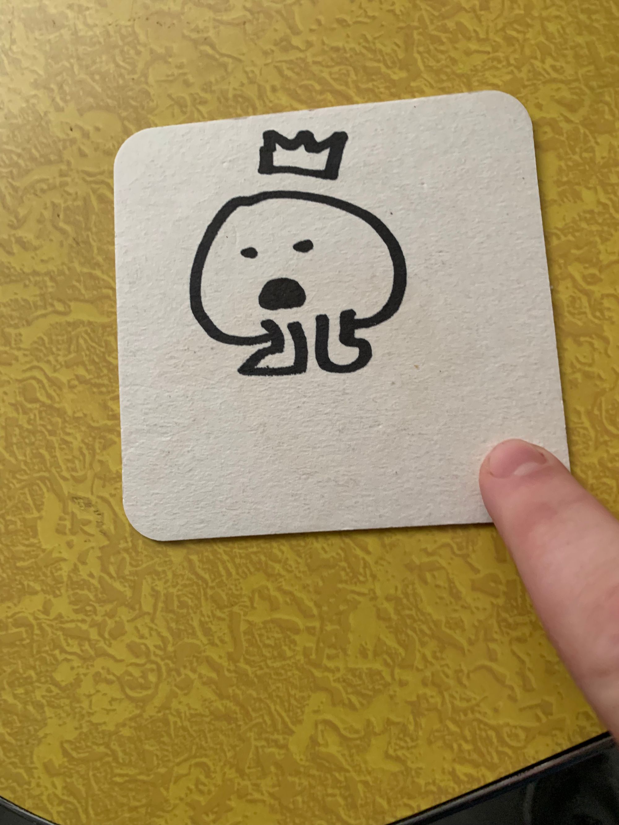 black line drawing of blob wearing crown