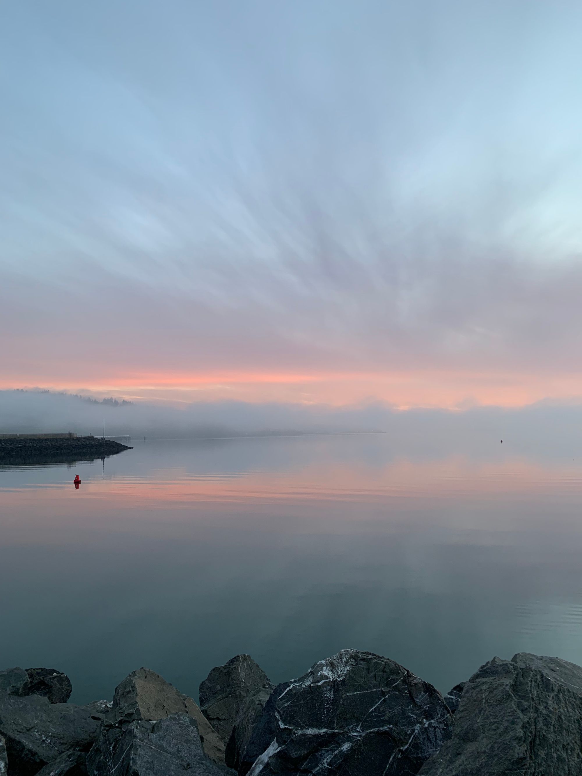 pink misty sunset, grey water & rocks