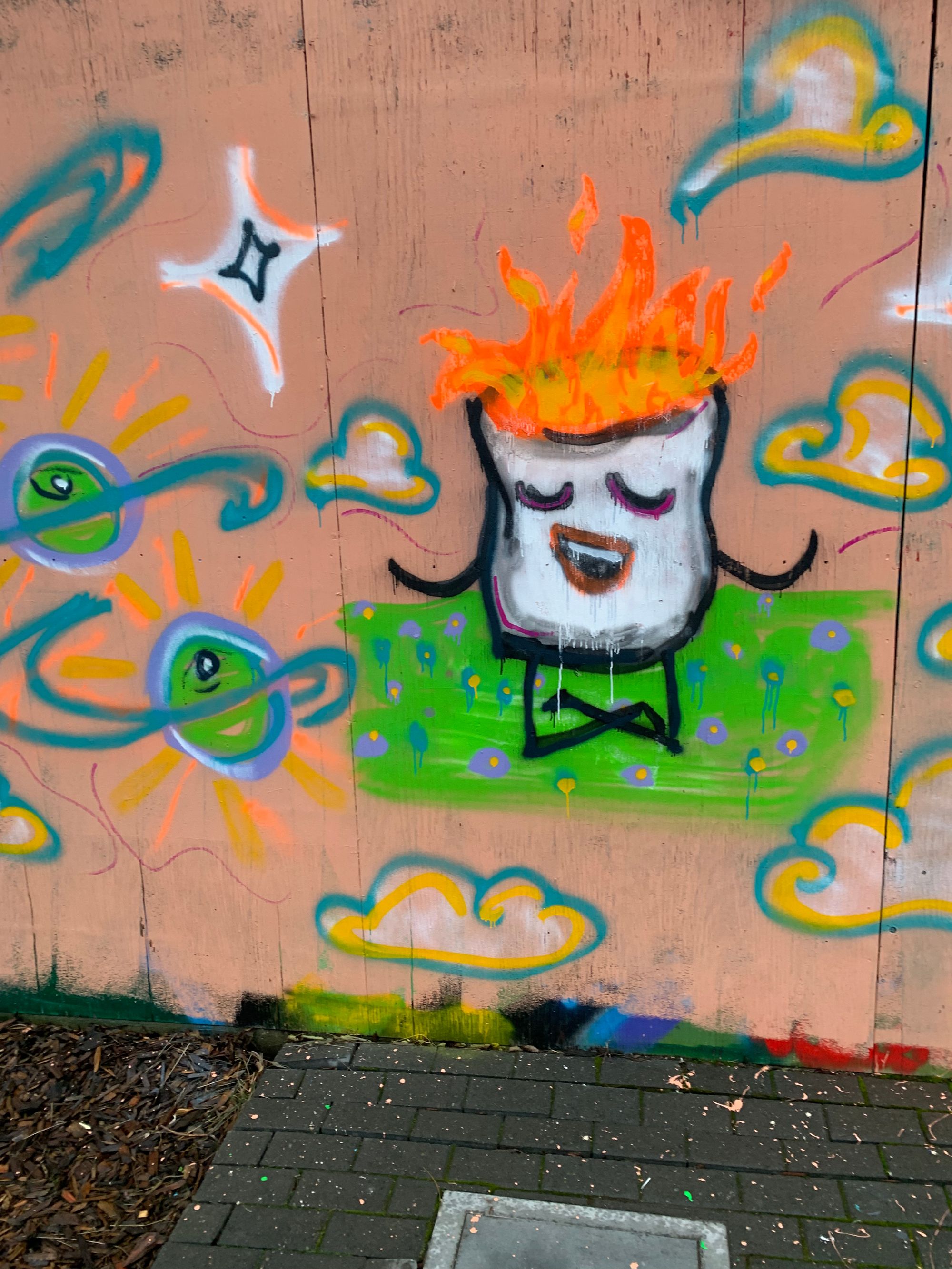 graffiti of a flaming marshmallow with a big smile